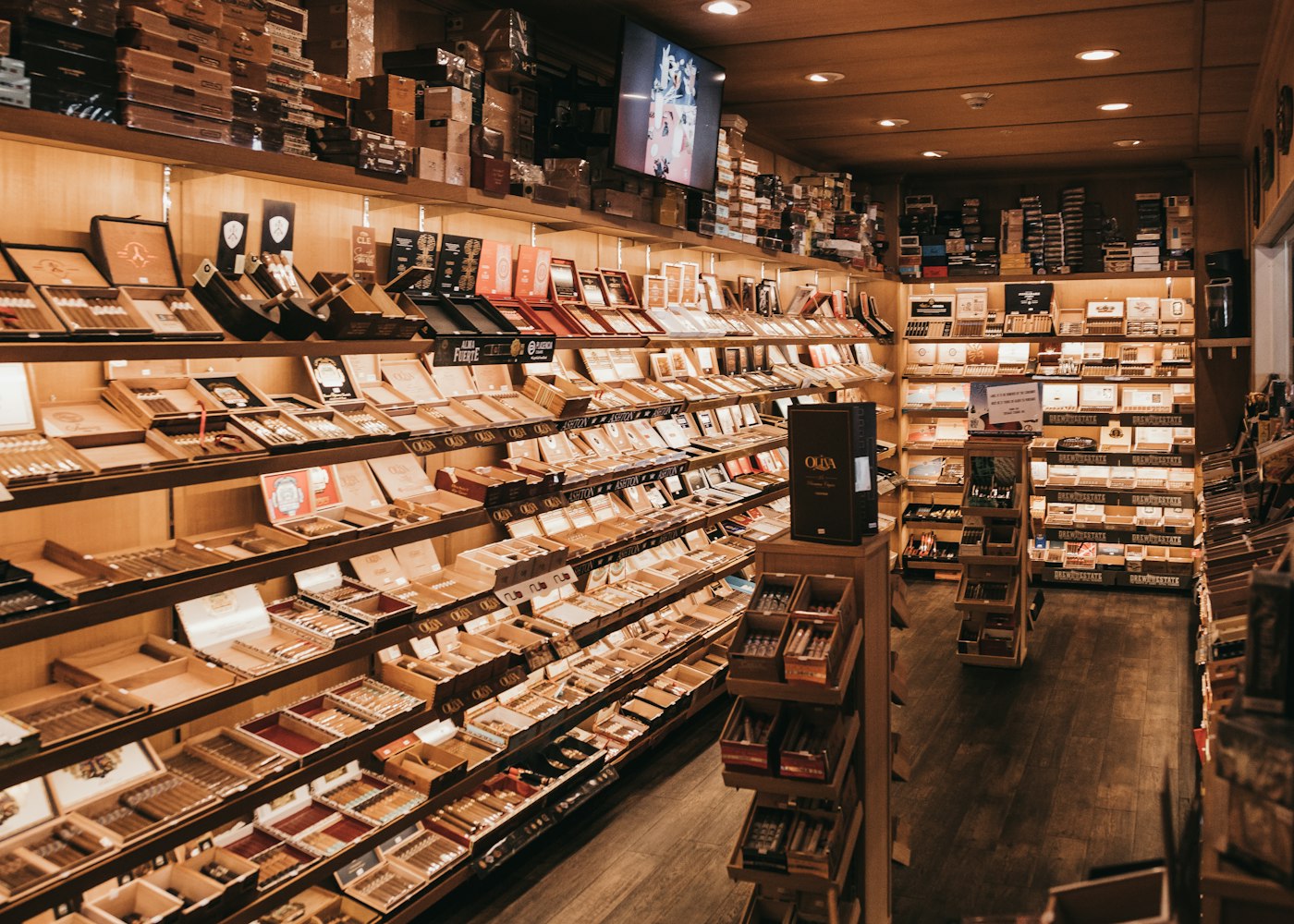 A walk-in humidor. Tariff costs show up as price lists and invoice surcharges, not at the register.